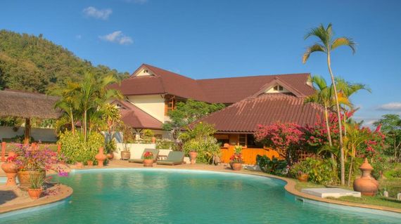 Laid back resort that's surrounded by a river and mountains.