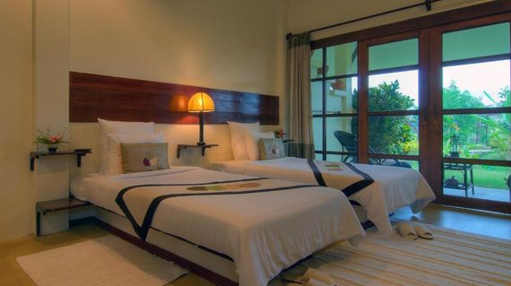 Laid back resort that's surrounded by a river and mountains.