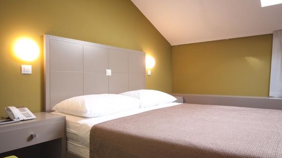 A few steps from Pula Arena with spacious contemporary rooms. 