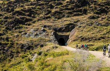 Cyclists entering a tunnel