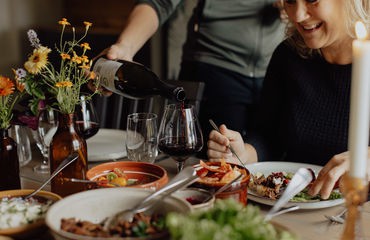 People sitting at table eating food