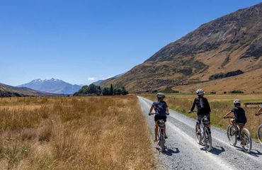Group including children cycling on rural route
