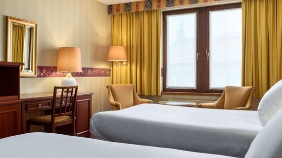 Cap off your days in comfortable accommodations such as NH Mechelen