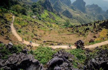 Cyclists on road in the mountains
