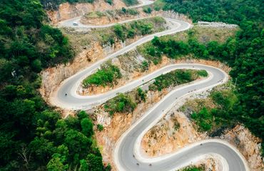 Road of switchbacks on side of hill