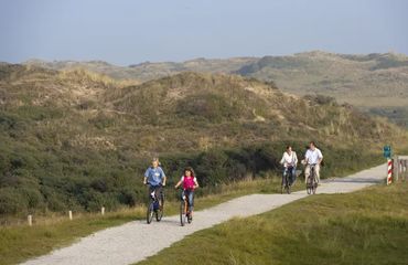 A family cycling on a bike path