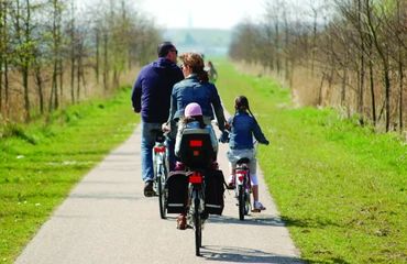 Family of cyclists on a bike path