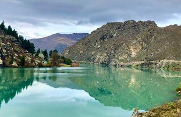 Reflective lake and mountains