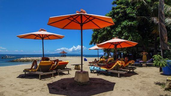 Balinese hotel on a white sandy beach