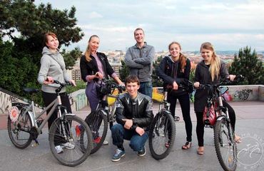 Cyclists posing for photo at city viewpoint