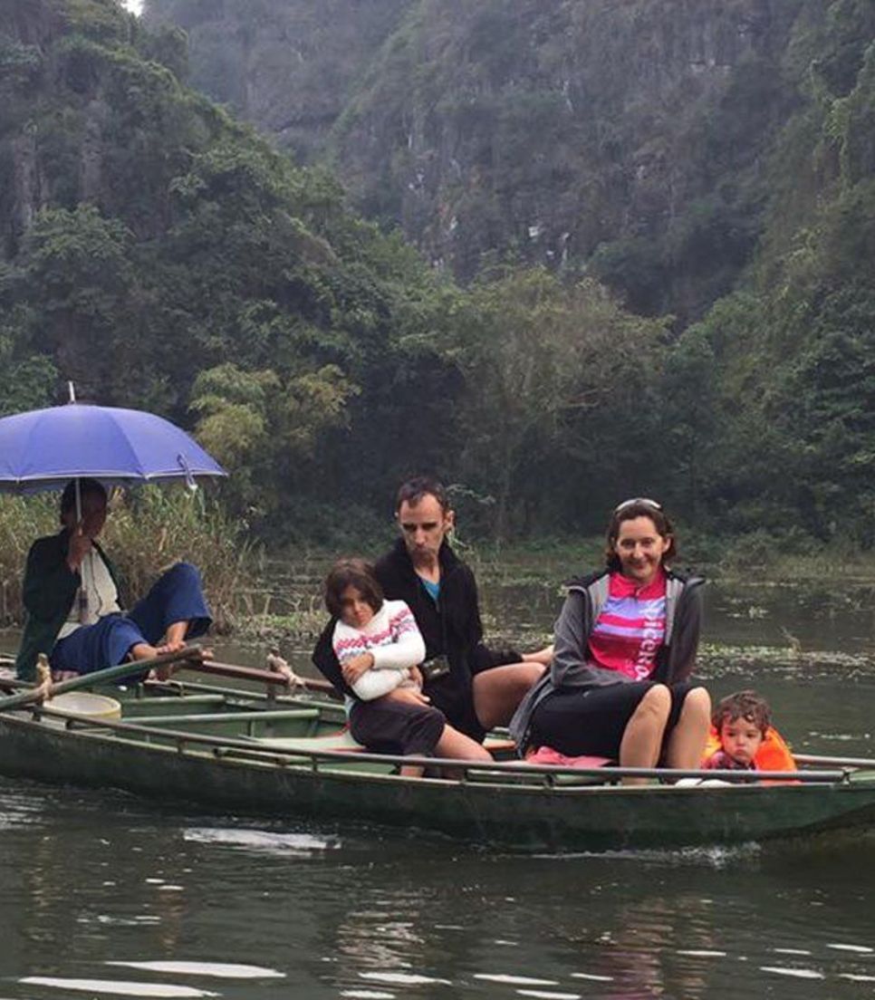 Put your feet up whilst the sampan rower uses his feet to row you through a cave and onto luscious green landscapes