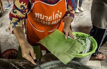Thai lady serving up food