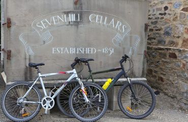Bikes leaning up against 'Sevenhill Cellars' sign