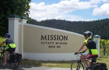 Cyclists riding into Mission Estate Winery