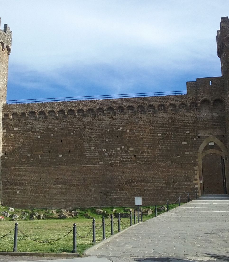 Cycle into Montalcino, a town well-known for its Brunello wine