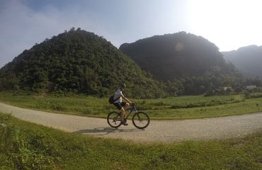 Biking alongside fertile hills
