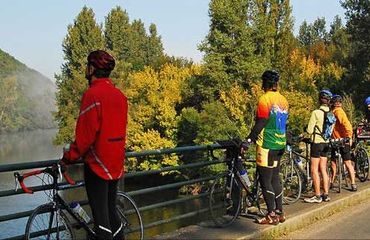 Group of cyclists looking over the water