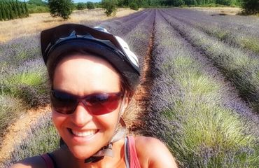 Female cyclist with lavender in background