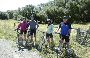 Group of cyclists posing with their bikes
