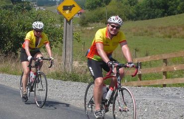 Cyclists riding along a rural road