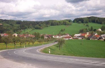 Quiet road with green hills