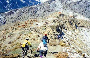Cyclists biking on a mountain ridge