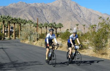 Cyclists road biking in the desert