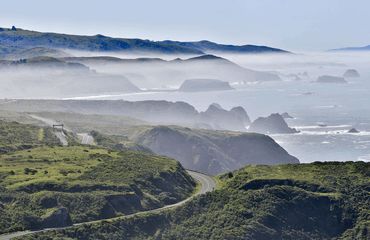 Fog rolling in over the hills from the sea