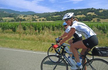 Close up of cyclists riding along wine roads