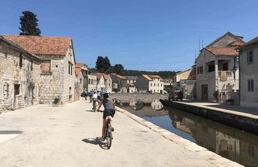 Biking through historic town by canal