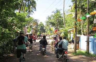 Cyclists and motorbikers on the Kerala streets