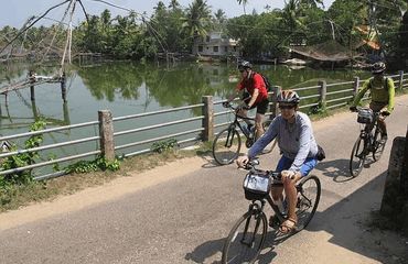 Cyclists riding across a bridge