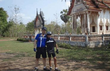 Cyclist and guide at Angkor