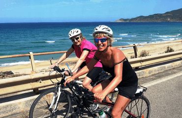 Ladies cycling on coastal road