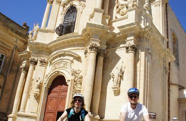 Cyclists outside of a church