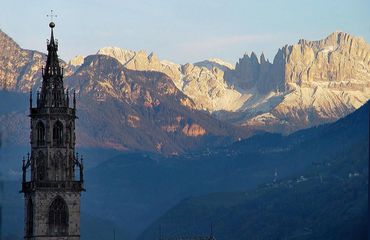 Bolzano church with Dolomites in background