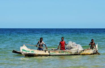 Fishermen in boat in sea