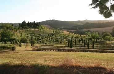 Gardens with hilly Tuscan landscape beyond