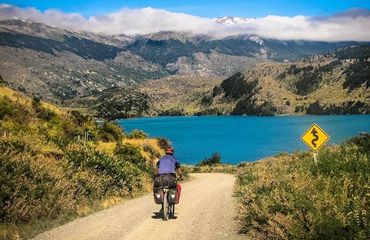 Biking towards blue mountain lake