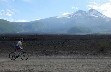 Cycling alongside mountain