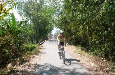 Cycling on path with lush vegetation