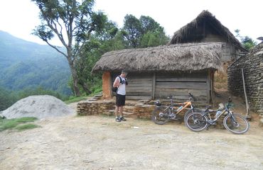 Man resting by a hut