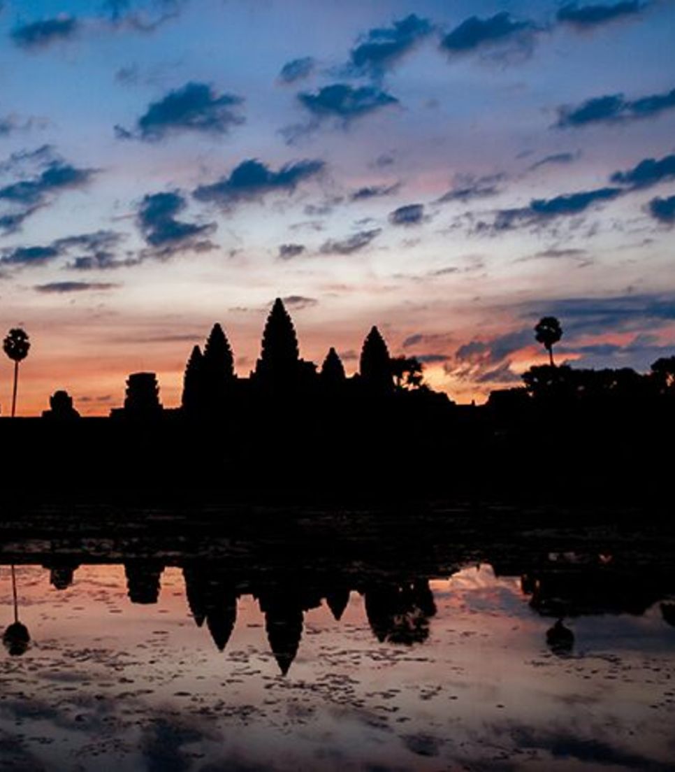 Go on a sunrise cycle to discover the ancient temples at Angkor