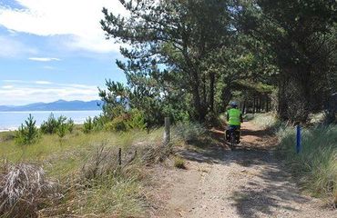 Cycling on a rural track by the sea