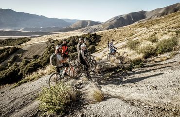 Group of cyclists on rocky terrain