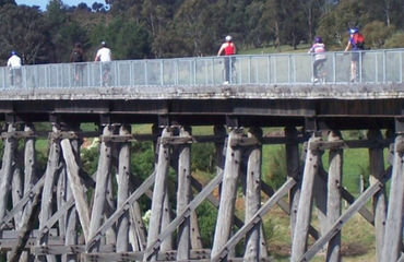 Cycling rail trail over trestle bridge