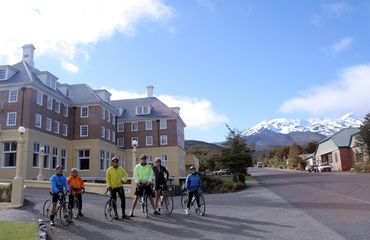 Group of cyclists with mountain in background