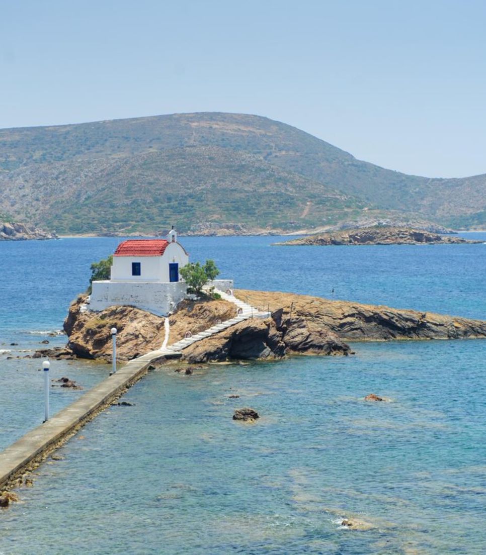 Island hop and visit sites such as the Agios Isidoros chapel