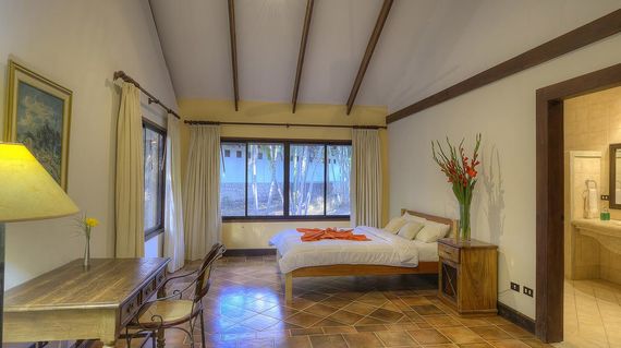 A rustic hotel surrounded by a rainforest and often visited by tropical birds