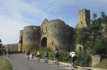 Road biking by historic building